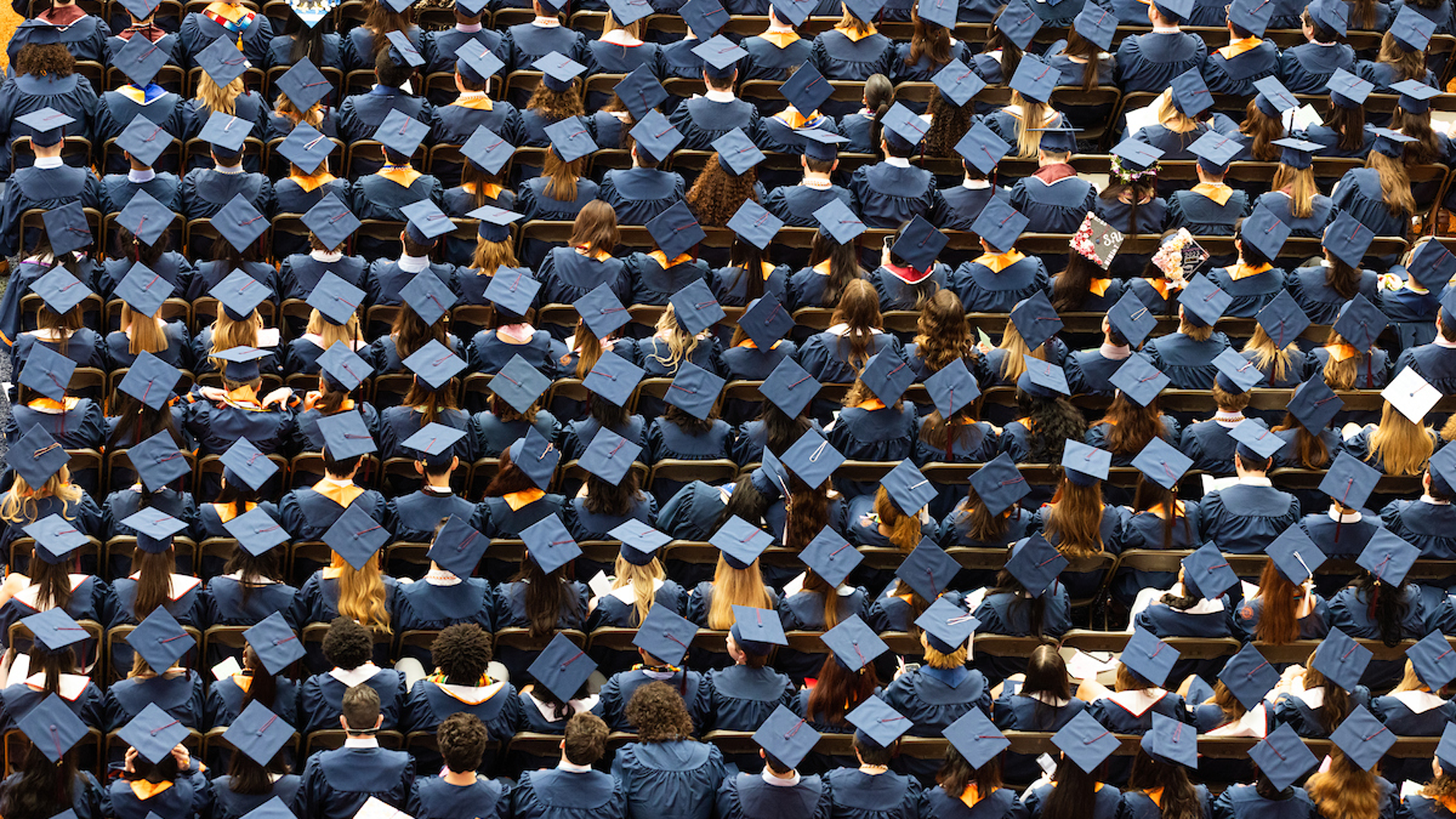 Syracuse University convocation - graduating students with graduation caps